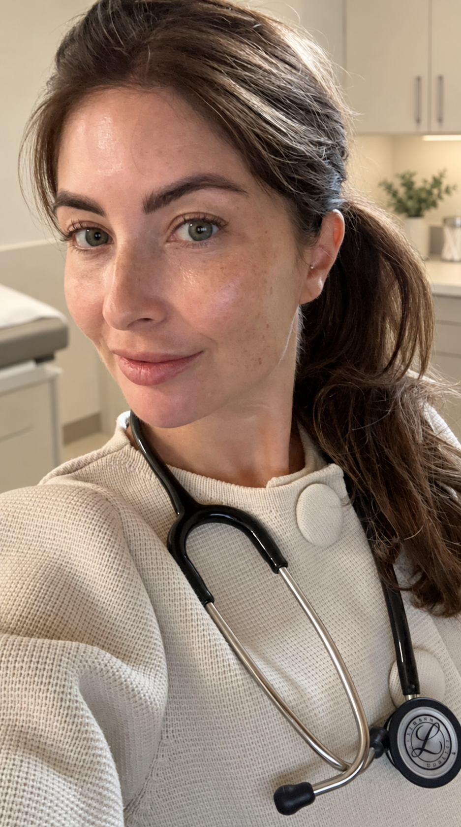 Dr Jo in a cream outfit with a stethoscope around her neck